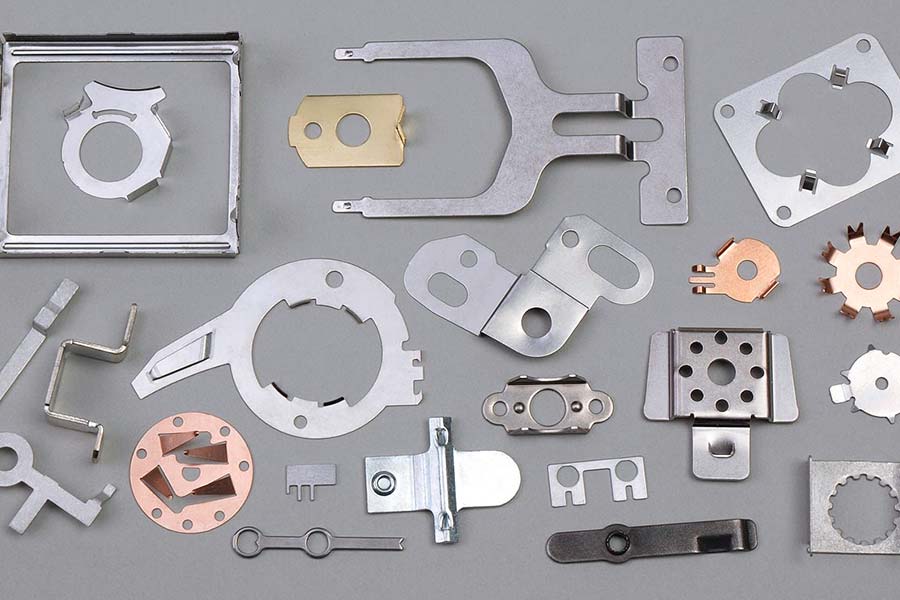 Composite materials and metal stamping